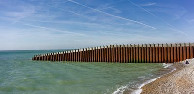 giant sea wall, small people, Seaford