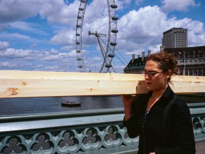 Woman carrying 2x2 PAR on Westminster Bridge