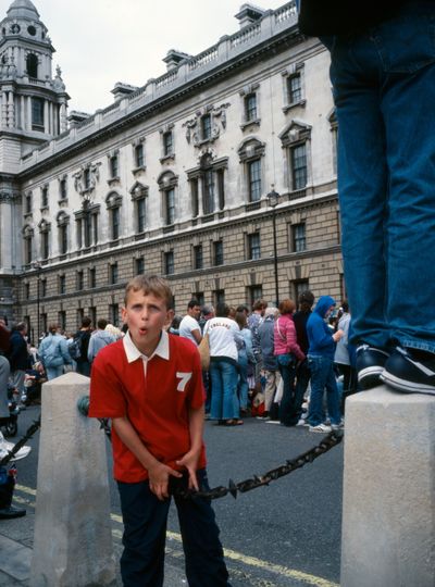 Boy caught on a chain between bollards