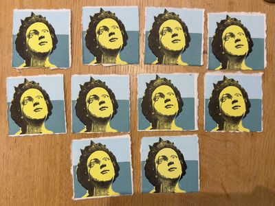 10 small prints of the head of a ship's figurehead